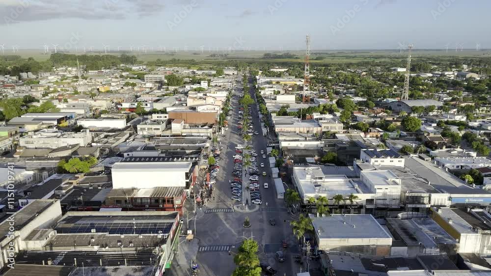 Drone flies west down main road on the border of Brazil and Uruguay