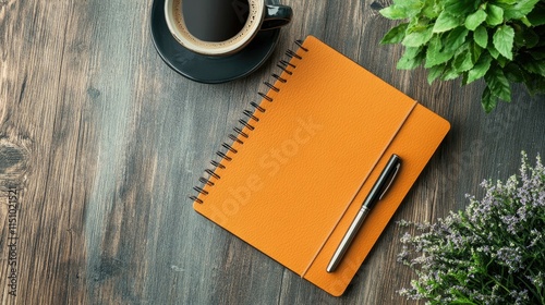 Orange Notebook, Coffee, and Plants on Wooden Table