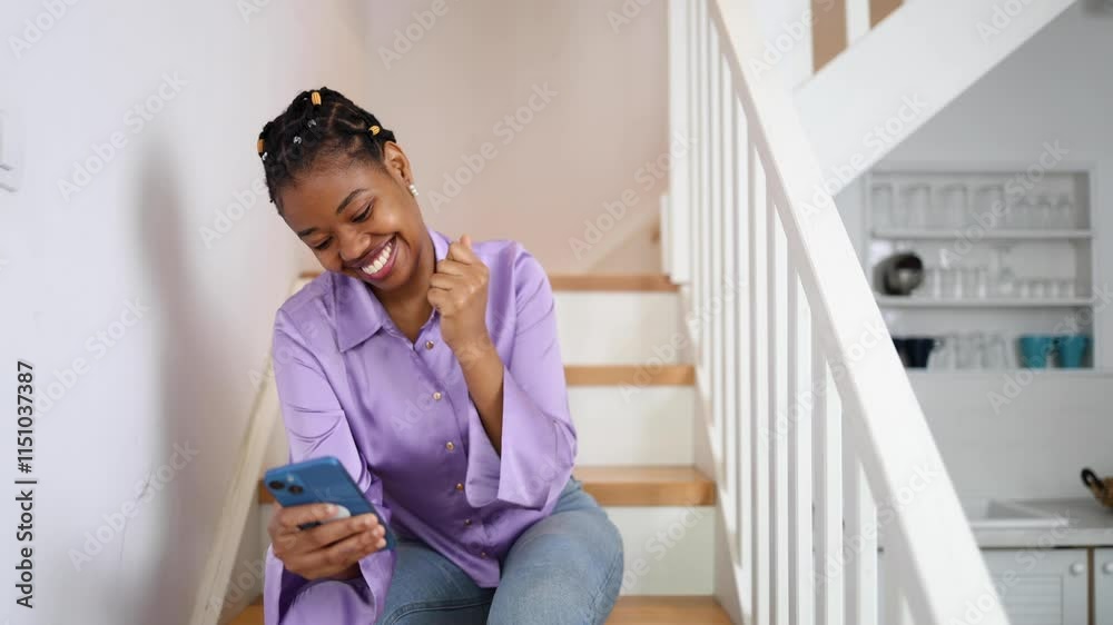 Young African American woman buying stuff on the web Young African American woman buying stuff on the web