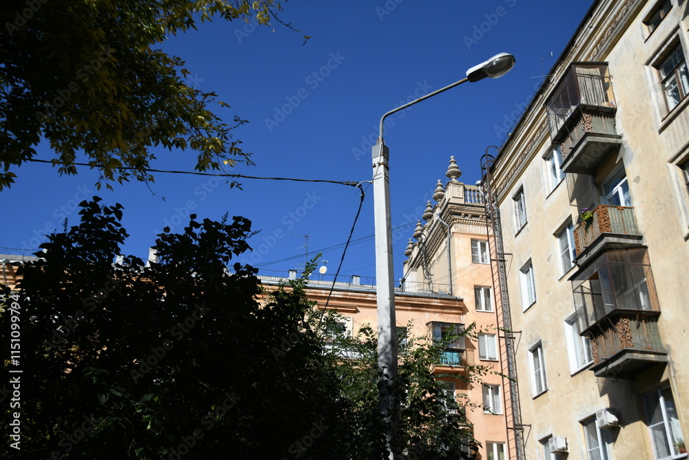 Architecture of old Soviet Union houses in Stalin's Empire style. Exterior of the facade of a vintage residential building in Russia Architecture of old Soviet Union houses in Stalin's Empire style. Exterior of the facade of a vintage residential building in Russia