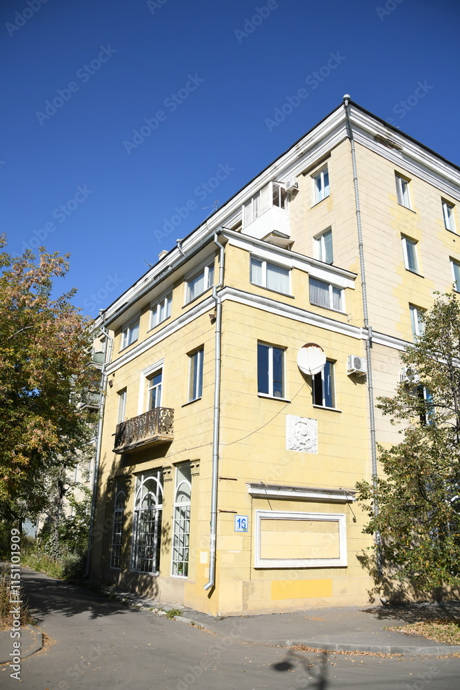 Architecture of old Soviet Union houses in Stalin's Empire style. Exterior of the facade of a vintage residential building in Russia Architecture of old Soviet Union houses in Stalin's Empire style. Exterior of the facade of a vintage residential building in Russia