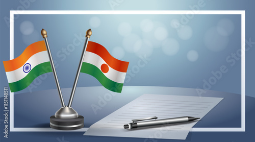 India and Niger National flags on small table with bokeh background, cooperative relationship