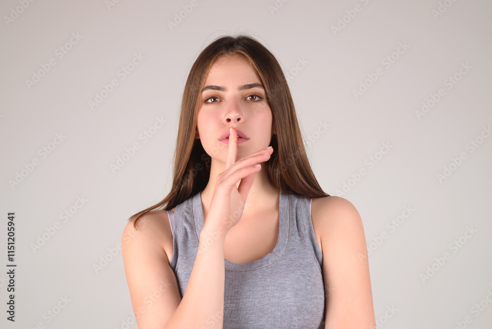 Shh, keep silence. Woman gesturing hush sign, on studio background. Finger on lips, silent gesture, secret. Woman asking for silence and quiet, gesturing with finger on mouth, shh or keeping a secret. Shh, keep silence. Woman gesturing hush sign, on studio background. Finger on lips, silent gesture, secret. Woman asking for silence and quiet, gesturing with finger on mouth, shh or keeping a secret.