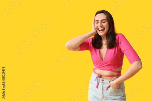 Smiling young woman on yell...
