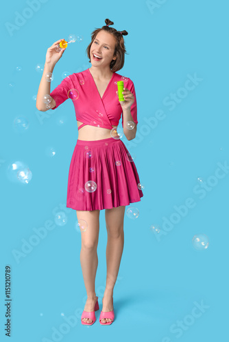 Happy teenage girl blowing ...