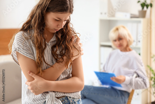 Teenage girl experiencing e...