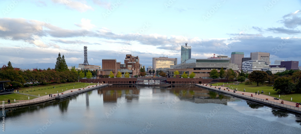 Naklejka premium View of Toyama city From the bridge over the canal in the Fugan Kansui Canal Park in Toyama City, Japan.