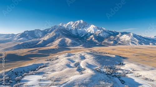 Breathtaking snowy mountain landscape under a clear blue sky.