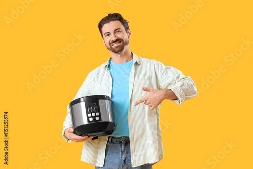 Young man pointing at multi...