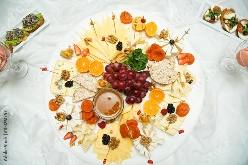 Different cheese and fruits on the buffet table