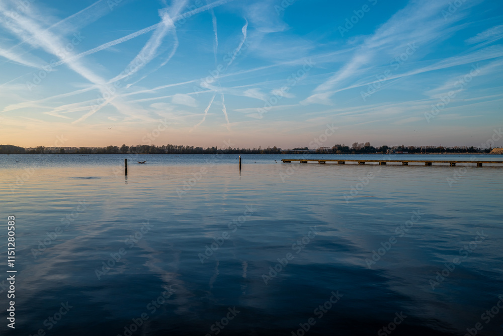 Beautiful colored sky by sunset with airplane trails Beautiful colored sky by sunset with airplane trails