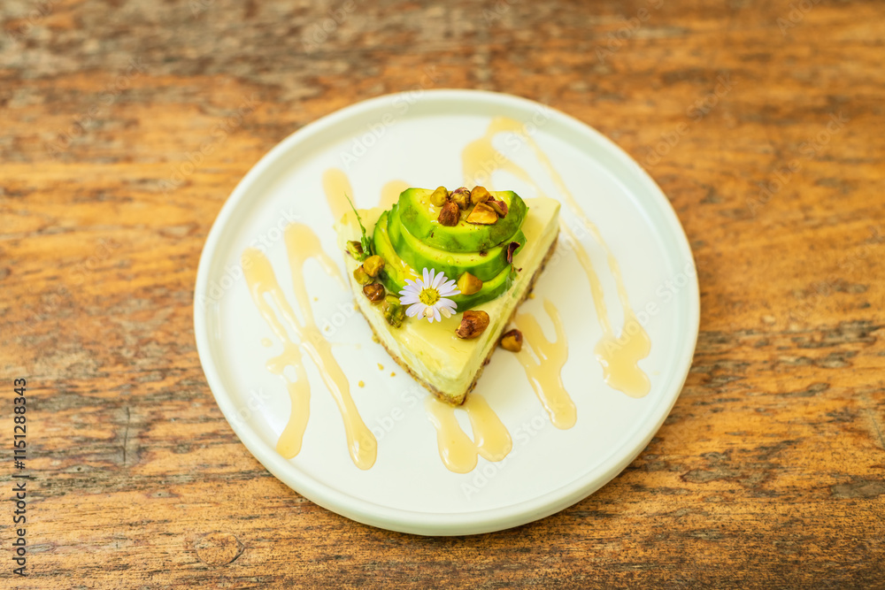 Close up of Avocado and Cheesecakes in the plate. Close up of Avocado and Cheesecakes in the plate.