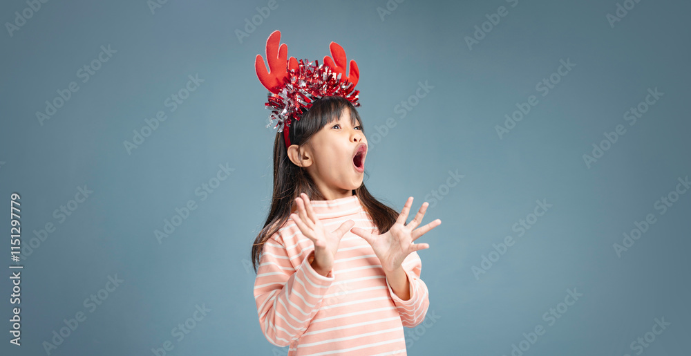 A little girl is happy to join the Christmas day. A little girl is happy to join the Christmas day.