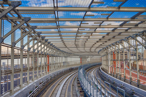 Japan Traveling. Cityscape View Taken From Monorail Odaiba Sky Train in Tokyo Against Blue Sky photo