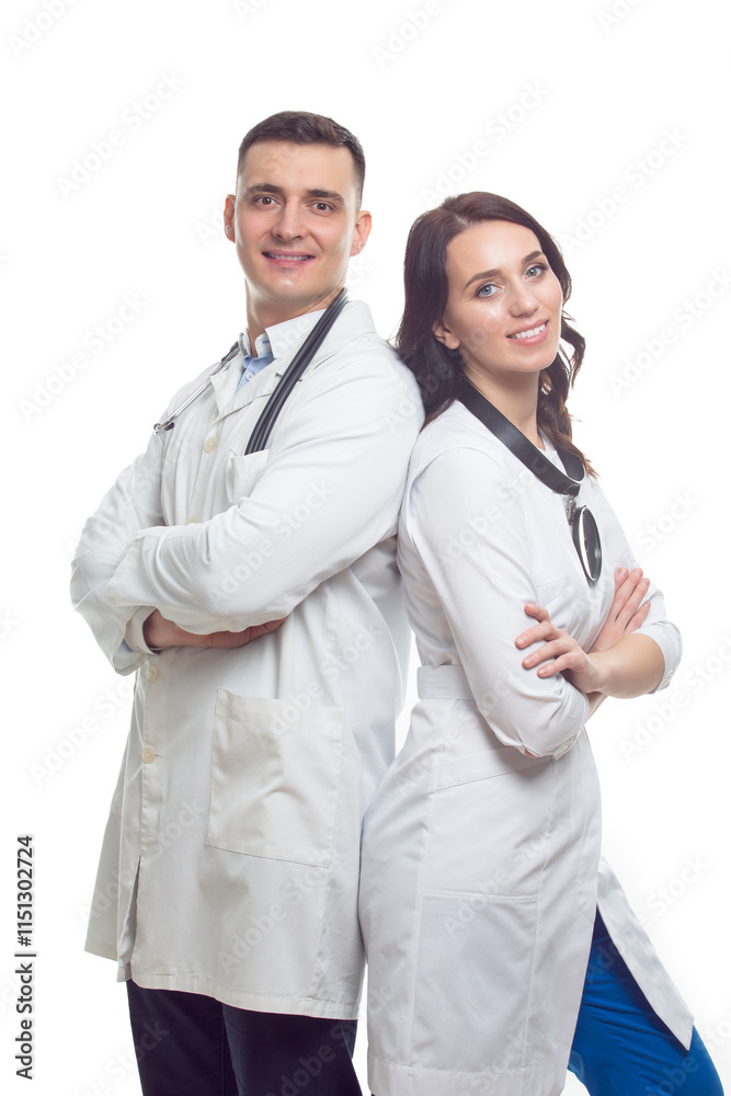 Portraits of People in Medicine. Two Positive Caucasian Doctors in White Smocks Posing Together Embraced Portraits of People in Medicine. Two Positive Caucasian Doctors in White Smocks Posing Together Embraced