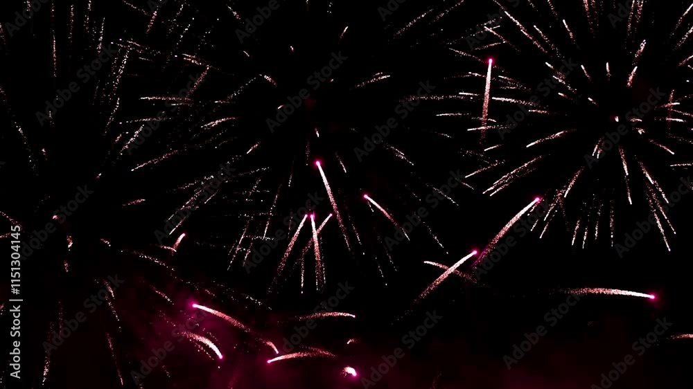 Bright colorful festive glowing fireworks on night sky.  New Year, Christmas, festival, party and holiday celebration concept