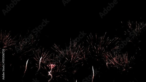 Bright colorful festive glowing fireworks on night sky.  New Year, Christmas, festival, party and holiday celebration concept