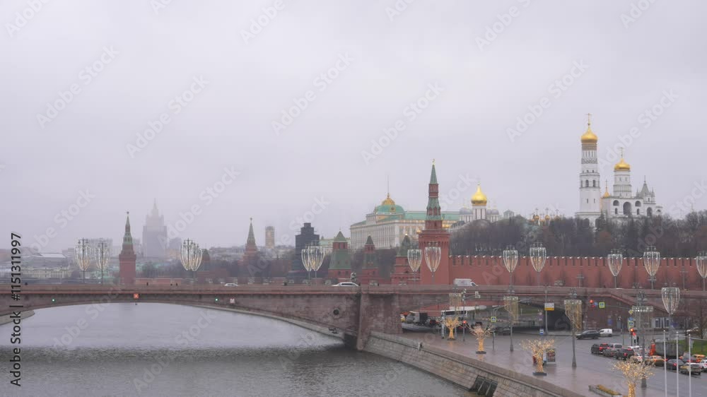 Famous Moscow Cityscape on a cloudy day with the Moskva River and the Kremlin fortress, a historic symbol of Russia Famous Moscow Cityscape on a cloudy day with the Moskva River and the Kremlin fortress, a historic symbol of Russia