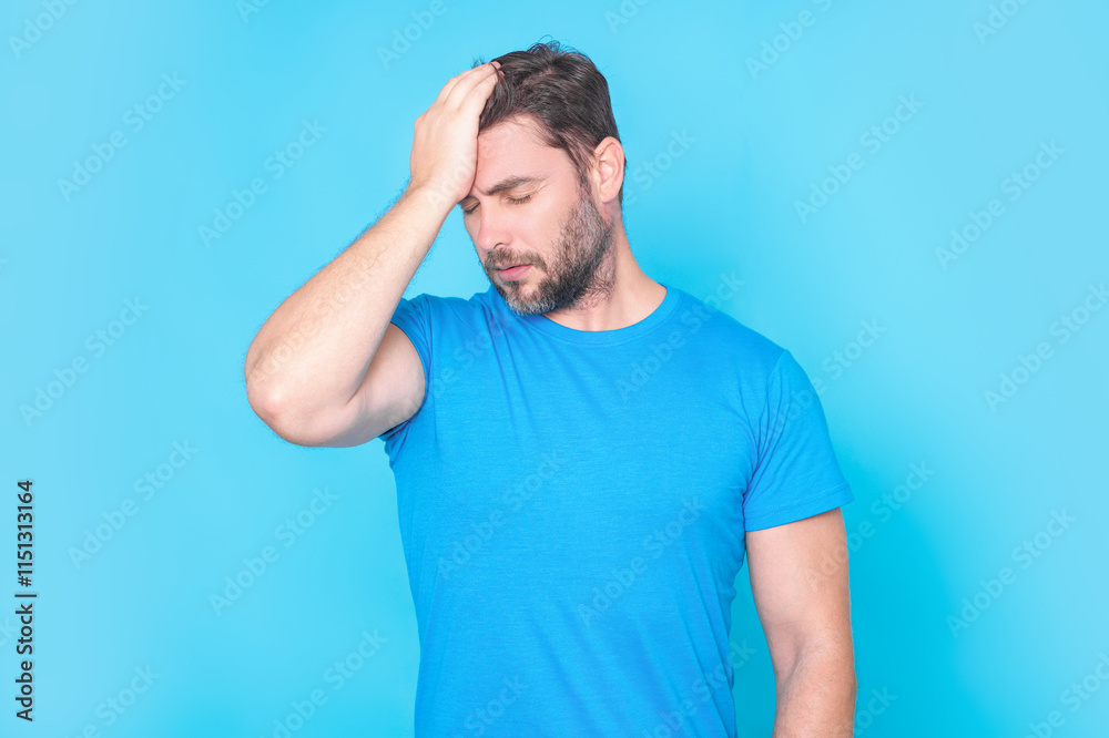 Man with headache, studio isolated portrait. Tired man having headache. Exhausted man feeling unhealthy, upset about headache illness. Migraine and headache concept. Migraine. Man with headache, studio isolated portrait. Tired man having headache. Exhausted man feeling unhealthy, upset about headache illness. Migraine and headache concept. Migraine.