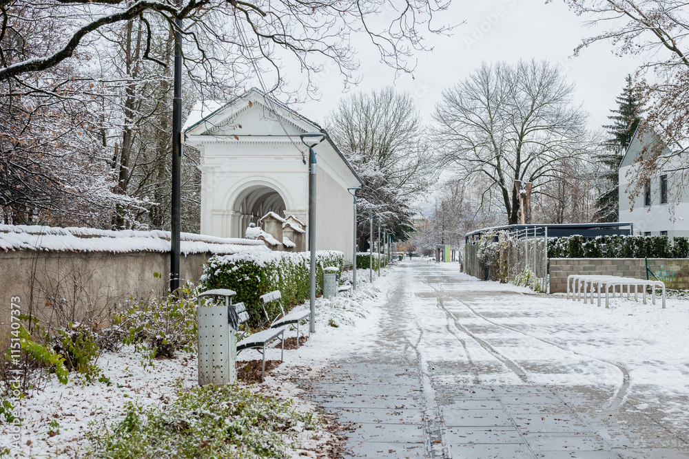 Park Navje on the northern part of ljubljana, border with bezigrad. Classical park in snow, with cleared pathway for pedestrians..