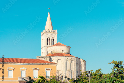 Cathedral St. Anastasia tower in Zadar, Croatia with clear sky photo