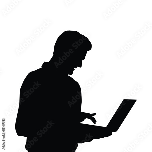 Silhouette of person using laptop