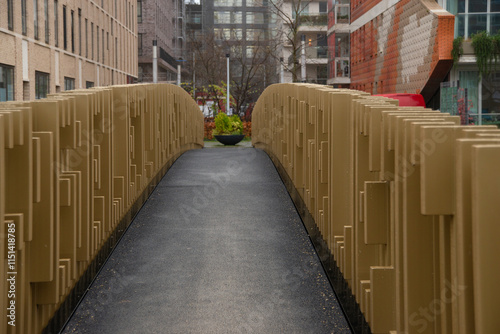 Modern architectur of pedestrian bridge across the canal in the city photo