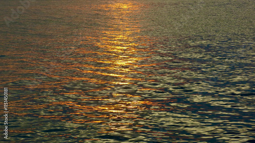 Photos The rays of the setting sun are reflected in the water