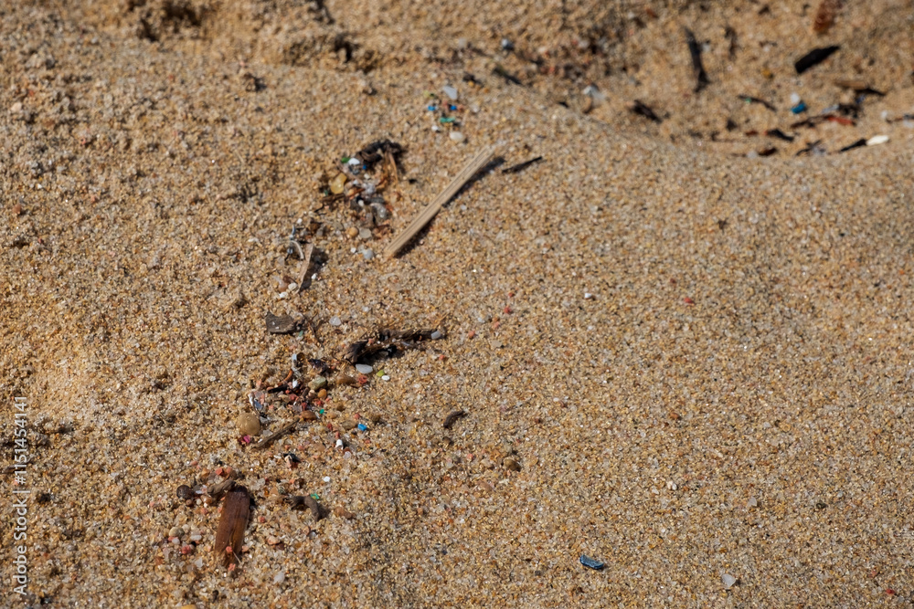 Micro plastic on a beautiful sandy beach of Gallura region in northern Sardinia, Italy Micro plastic on a beautiful sandy beach of Gallura region in northern Sardinia, Italy