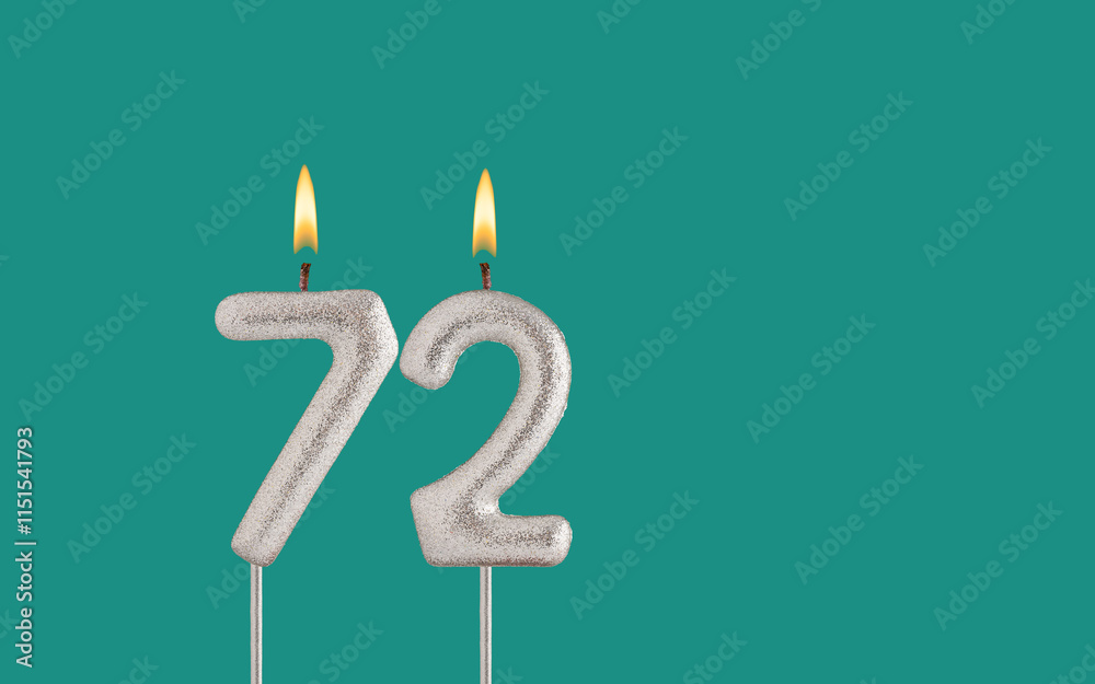 Birthday candle number 72 - Card on a green background.