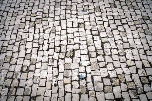 cobblestone street in the city photo