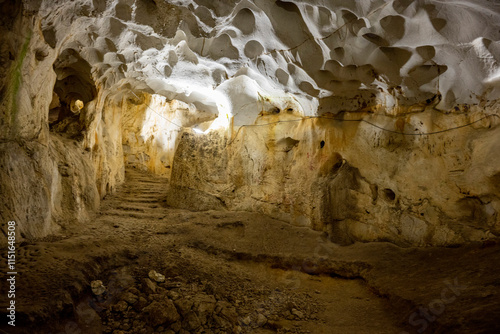 Interior of the large hall of old Karain cave, hidden in Mediterranean region. Confirms human habitation since the early Paleolithic age between 150,000 and 200,000 years ago.Yagca, Antalya, Turkey. photo