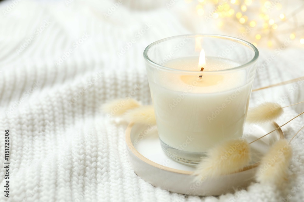 Beautiful composition with candle on white fabric Beautiful composition with candle on white fabric