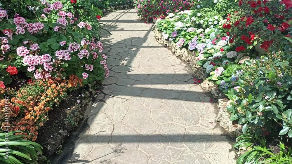 walkway pathway in blooming flower garden park