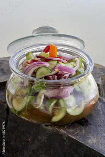 Obraz na płótnie Homemade thai cucumber slices, chili slices and shallots relish slices and vinegar in a glass jar. Ajat, use it as your Wallpaper, Poster and Space for text, Selective focus. w salonie