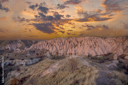 Obraz na płótnie Fairy Chimneys are world-famous natural formations located in the Cappadocia region of Turkey. They were formed by wind and water erosion of volcanic tuff layers over thousands of years. w salonie