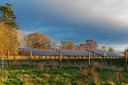 Part of the Solar Park near the small Angus settlement of Pitmuies, with the Panels tilted towards the south and the Park fenced off by a high metal fence.
