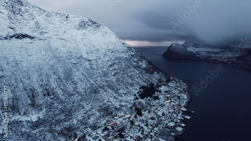 Wallpaper Mural An expansive aerial shot showcasing the stunning Gryllefjord on the island of Senja, Norway. The fjord's deep blue waters contrast beautifully with the rugged mountain terrain and the surrounding pict Torontodigital.ca