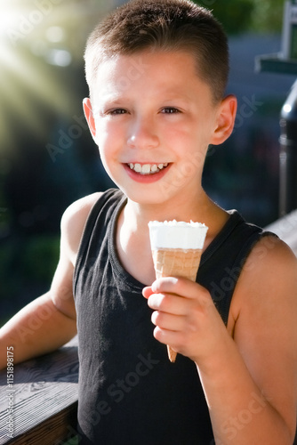 A happy child with ice cream in hands in nature travel