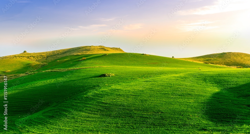 scenery rural view of a contryside farm in green fields and hills with amazing cloudy sky on background scenery rural view of a contryside farm in green fields and hills with amazing cloudy sky on background