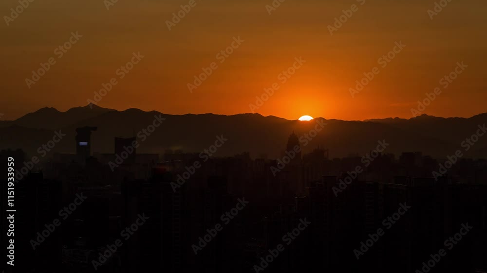 BEIJING, CHINA - OCTOBER 7, 2024: Stunning beijing timelapse capturing the vibrant sunset over the city skyline and distant mountains