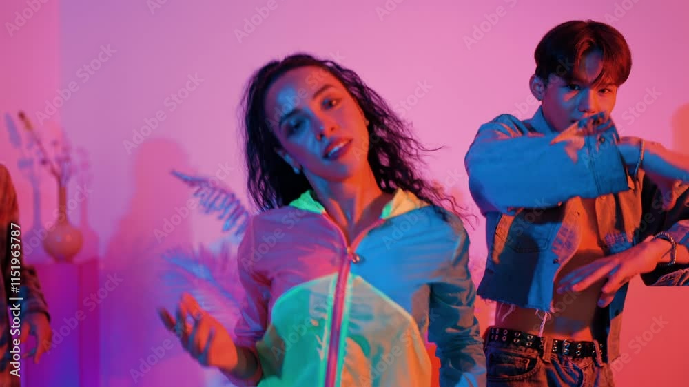 Professional hispanic girl dancing together with diverse friend cheering and supporting his performance. Skilled break dancer looking and moving to freestyle and hip hop music. Lifestyle. Regalement.