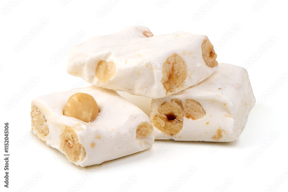 White nougat bar with hazelnuts, packaged, isolated on white background. White nougat bar with hazelnuts, packaged, isolated on white background.