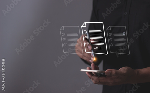 Young man with smartphone mobile hand using a pen touching to sign a Online Business Contract, Contract signing, Electronic signature, Digital documents, Future smart contract