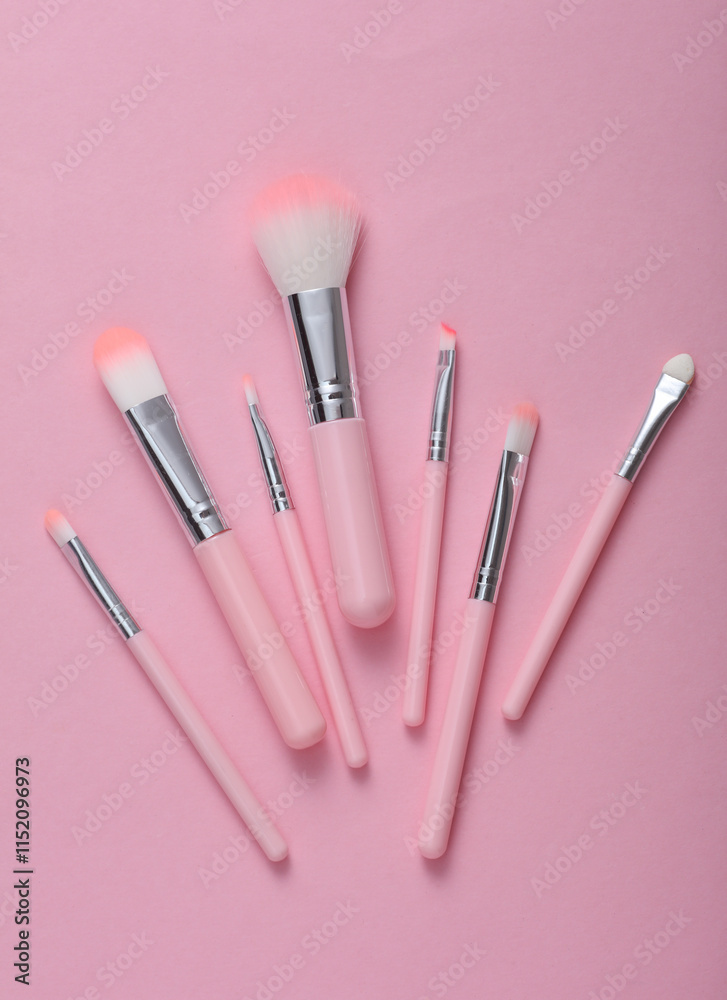Set of makeup brushes on pink background Set of makeup brushes on pink background