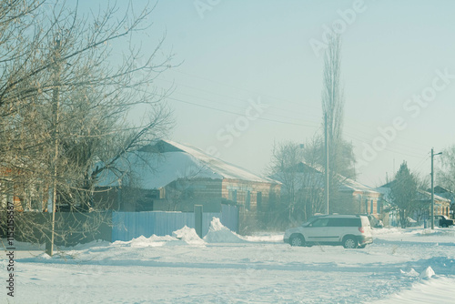 Wallpaper Mural Winter landscape. A beautiful snow-covered village in the winter season. Small red brick houses in winter.. Torontodigital.ca