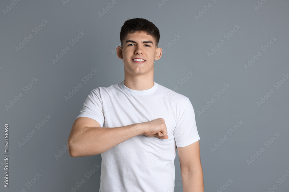 Man making promise on grey background. Oath gesture Man making promise on grey background. Oath gesture