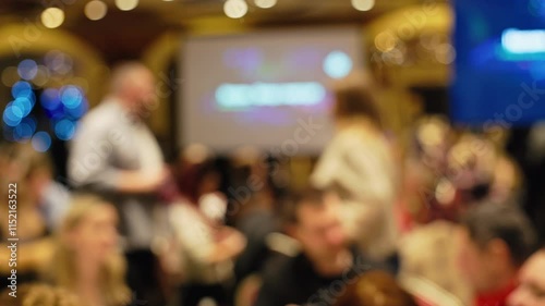 Wallpaper Mural Footage featuring a blurred background of a busy event showcasing engaged and interacting guests throughout the scene Torontodigital.ca