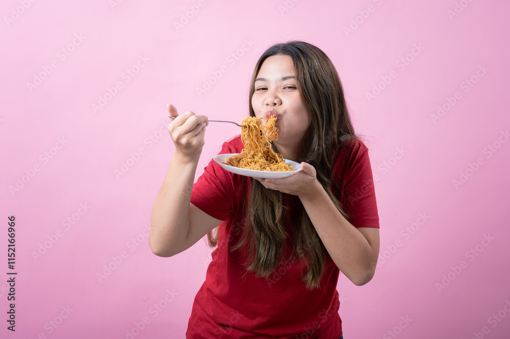 Young woman in a red shirt with long brown hair holds a fork and plate of noodles, shouting excitedly. The scene has a pink background, creating a lively and humorous atmosphere. Young woman in a red shirt with long brown hair holds a fork and plate of noodles, shouting excitedly. The scene has a pink background, creating a lively and humorous atmosphere.