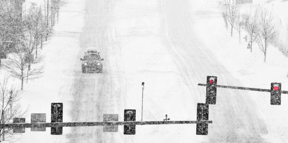 Obraz premium Driving on Snow and Snowy Roads in Winter Blizzard Cars on Icy Street